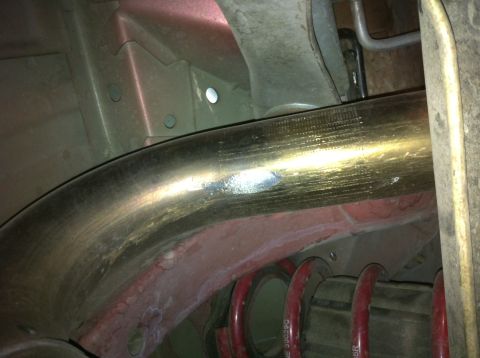 1995 Ford Mustang - Undercarriage view shows exhaust pipe and suspension parts, with 'SUPERMOTORS' logo visible.