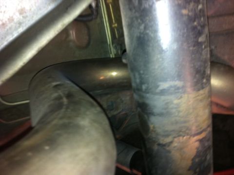 1995 Ford Mustang - Undercarriage view showing exhaust system components and suspension parts.