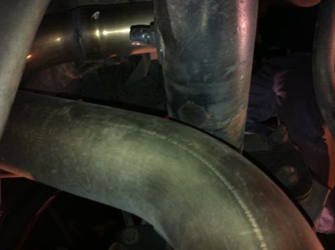 1995 Ford Mustang - Detail shot of exhaust pipes, possibly from a Magnaflow Magnapack system, with a Supermotors.net watermark visible.