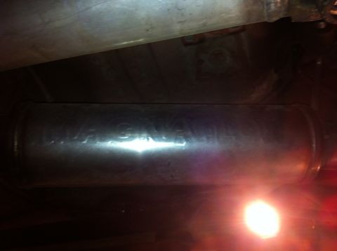 1995 Ford Mustang - Close-up of a Magnaflow exhaust muffler, part of a vehicle's exhaust system.