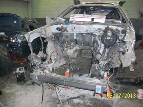 1999 Isuzu Vehicross - This vehicle's front end is heavily damaged, with the engine removed and exposed wiring visible. The photo was taken on March 7, 2013.