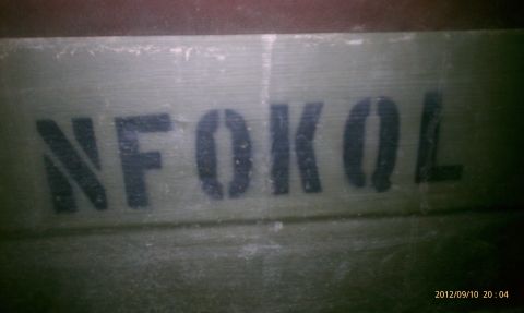 1986 Chevrolet Blazer - Stencil text "N F O K O L" is visible on a weathered green surface.