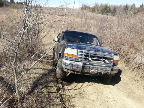 1995 Ford Bronco - This 1995 Ford Bronco navigates a muddy, off-road trail.