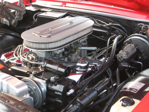 1967 Ford Galaxie - Close-up view of a V8 engine bay, a chrome air cleaner and various engine components.