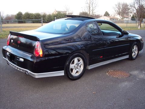 2002 Chevrolet Monte Carlo - This black Chevrolet Monte Carlo SS is shown from a rear three-quarter view, highlighting its sporty design and spoiler.