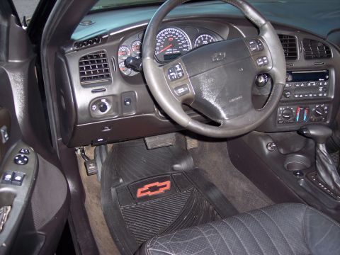 2002 Chevrolet Monte Carlo - Interior view of a 2002 Chevrolet Monte Carlo, showing the dashboard, steering wheel, and floor mats.