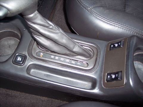 2002 Chevrolet Monte Carlo - Interior view of a car's center console, highlighting the gear shifter and heated seat controls.