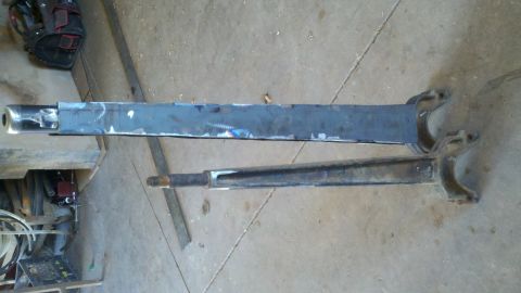 1996 Ford Bronco - Two suspension components are shown side-by-side, with one appearing to be modified or fabricated.