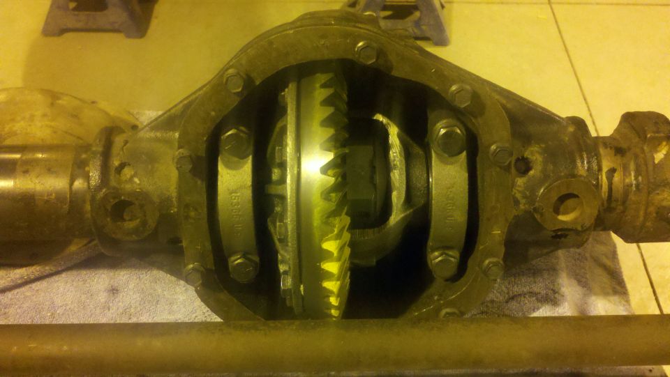 Differential axle housing with internal gears, showing wear and dirt