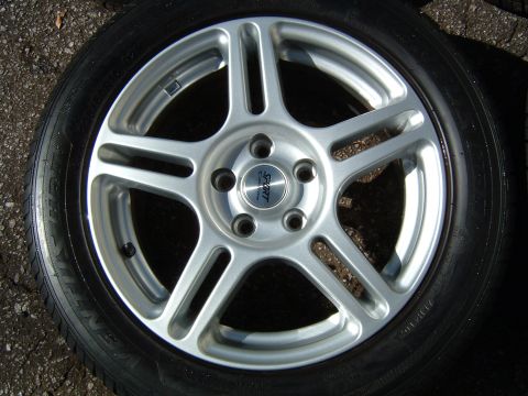 1997 Ford Taurus - A single silver alloy wheel with a black tire is shown up close.