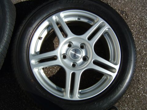 1997 Ford Taurus - Aftermarket wheel with tire, labeled as 1997 Ford Taurus part.