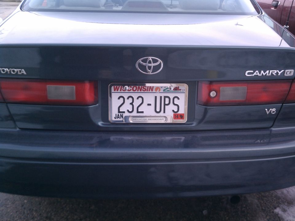 Rear of a 1998 Toyota Camry with a Wisconsin license plate that reads 232-UPS