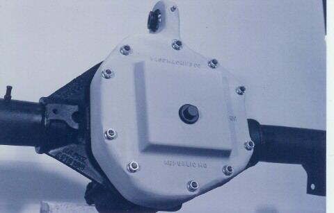 1988 Ford Bronco - Close-up view of a rear axle differential cover, showing bolted construction and some legible markings.