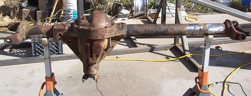 Cleaned up axle pics.
Keith plasma'ed off the shock mounts, and the leaf perch.
We then shared the duty of grinding the axle clean.