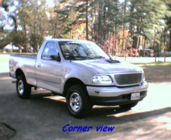 2000 Ford F-150 - This silver 2000 Ford F-150 pickup truck is shown from the front three-quarter angle.
