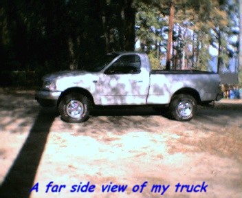 2000 Ford F-150 - Side view of a silver 2000 Ford F-150 pickup truck.