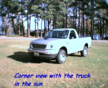 2000 Ford F-150 - Corner view of a 2000 Ford F-150 pickup truck in the sun.