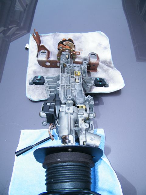 2004 Ford Crown Victoria - This image shows a disassembled steering column ignition assembly, likely for repair or replacement.