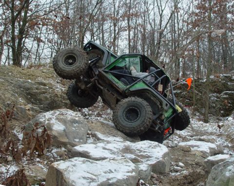 1992 Ford Bronco - An extreme off-road vehicle navigates a challenging rocky course during an event.