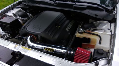 2010 Chrysler 300 - The HEMI V8 engine and AEM cold air intake are visible in this engine bay shot.