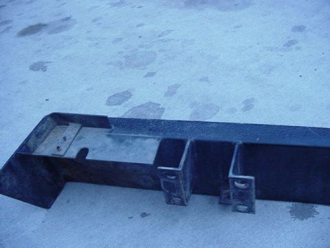1992 Ford Bronco - This is a part of a vehicle bumper, shown on a concrete surface.
