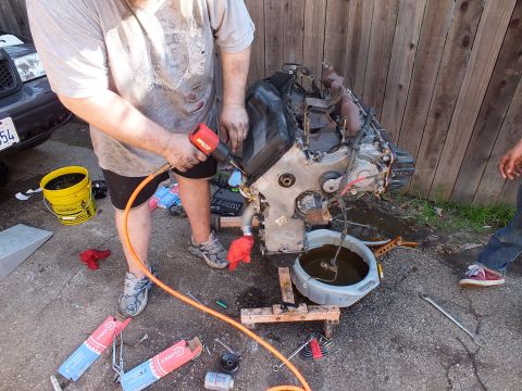 2003 Ford Crown Victoria - Impact wrench applied to a dismantled engine block during a backyard rebuild session