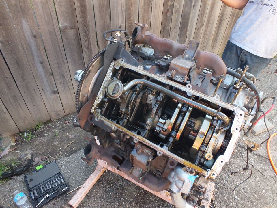 Engine block underside showing crankshaft, oil pickup gallery and main caps