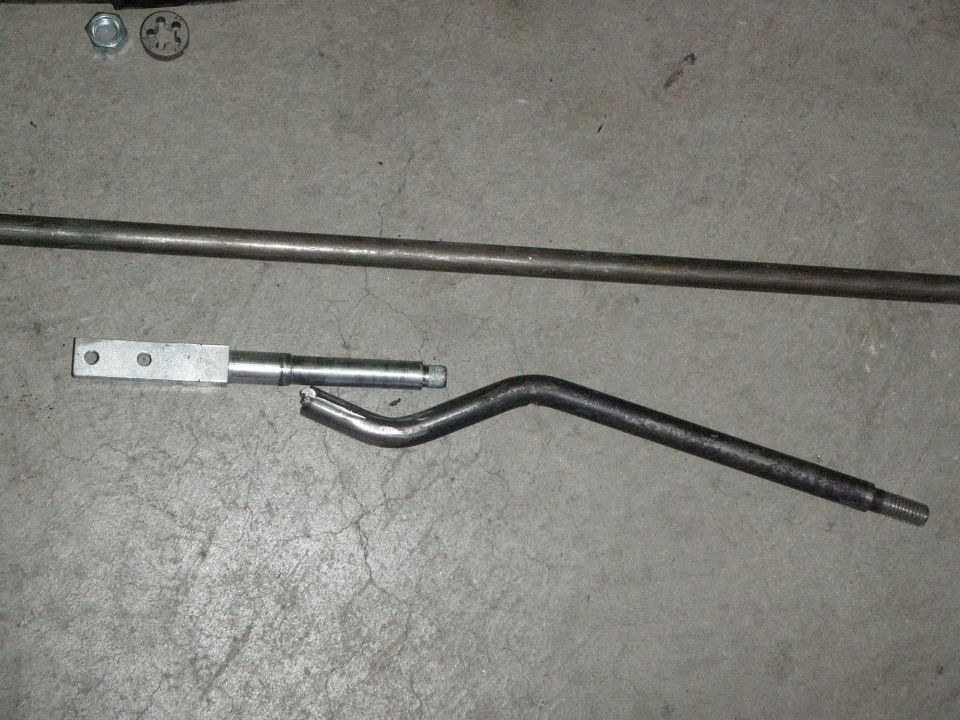 Broken metal rod and bent lever with threaded end