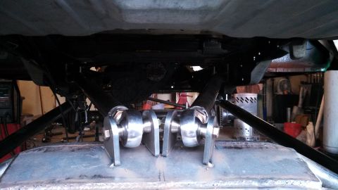 1967 Ford F-250 - Custom rear suspension components are visible, mounted to the underside of a vehicle's frame.