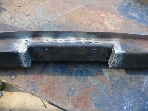 1976 Chevrolet Corvette - A close-up view of a fabricated steel bumper section, showing the results of welding and metalwork.