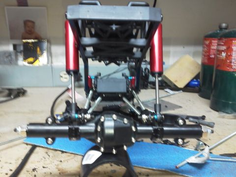 1985 Ford Bronco - Close-up of an RC car's suspension and drivetrain components.
