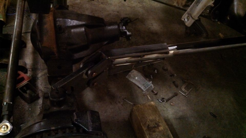 Rear axle assembly and driveshaft with tools on floor