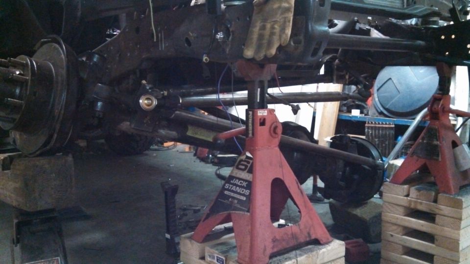1967 Ford F-250 frame and rear axle assembly on jack stands