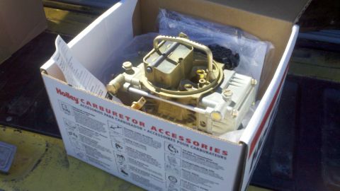 1978 Ford Bronco - New Holley carburetor in its original packaging with accessory information.