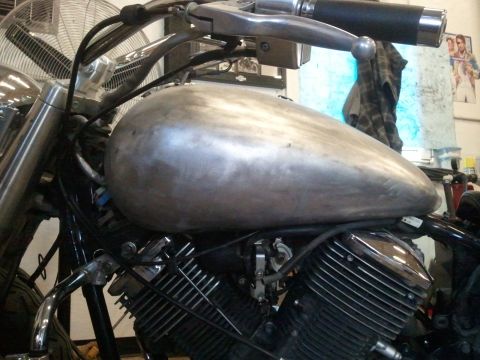 1995 Ford F-150 - Motorcycle fuel tank and engine detail, likely undergoing customization or repair.