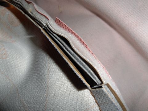 1990 Ford Bronco - Detail of a tire cover's layered construction, showing fabric and padding.
