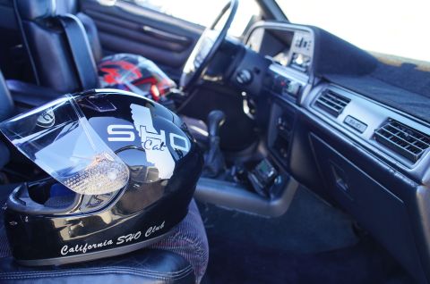 1995 Ford Taurus - Helmet from the California SHO Club sits on the passenger seat inside a 1995 Ford Taurus.