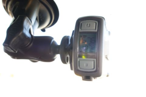 1995 Ford Taurus - A digital device, possibly a GPS or weather station, is mounted to a car's windshield.
