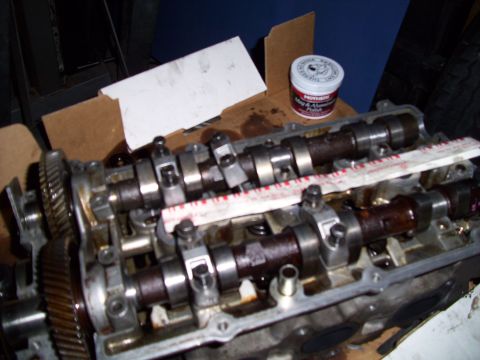 1995 Ford Probe - Close-up of an engine's cylinder head, showing camshafts and associated components.