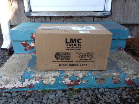 1979 Ford Bronco - A package from LMC Truck sits on weathered porch steps, ready for pickup.