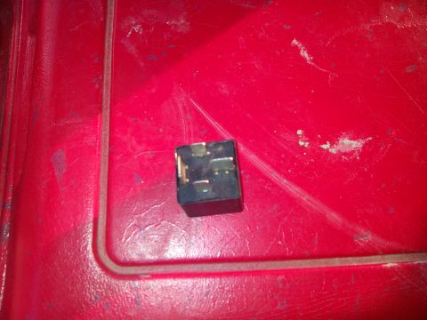 1979 Ford Bronco - A single automotive relay is shown against a red background.