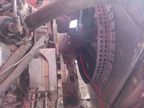 1979 Ford Bronco - Close-up of engine components including fan and alternator.