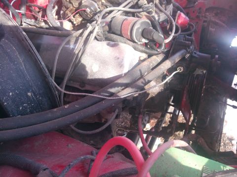 1979 Ford Bronco - Close-up view of a vehicle's engine bay, showing various components and wiring.
