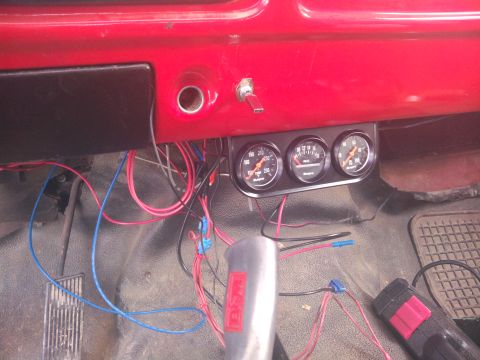 1979 Ford Bronco - Aftermarket gauges and wiring are visible under the dashboard of this vehicle.