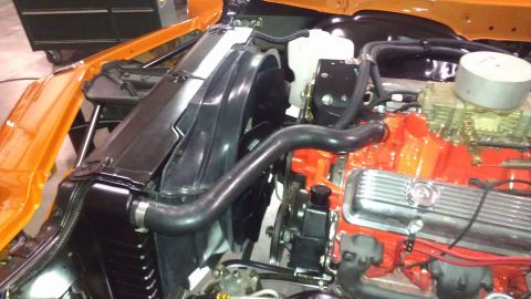 1973 Chevrolet Camaro - Close-up view of the engine bay, focusing on the radiator and fan assembly next to the engine.