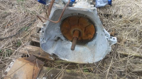 1995 Ford Bronco - This is a rusted automatic transmission part, likely from an older vehicle.