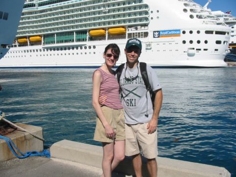 1992 Ford Bronco - A couple poses for a photo on a dock with a large cruise ship in the background.
