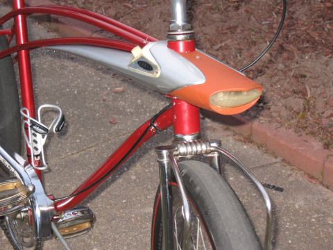 1994 Ford Bronco - Close-up of a vintage bicycle's headlight and front fork assembly.