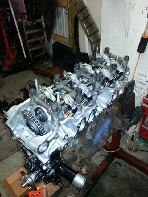 1987 Toyota 4Runner - Engine block assembly with valve train components and timing chain visible, mounted on an engine stand.