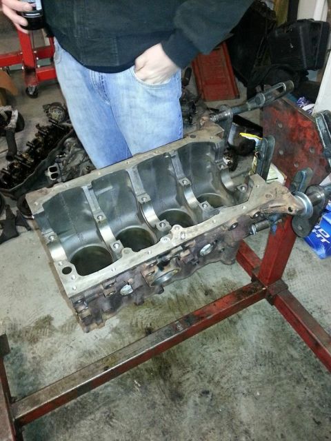 1987 Toyota 4Runner - Engine block on a stand, ready for work in a garage.